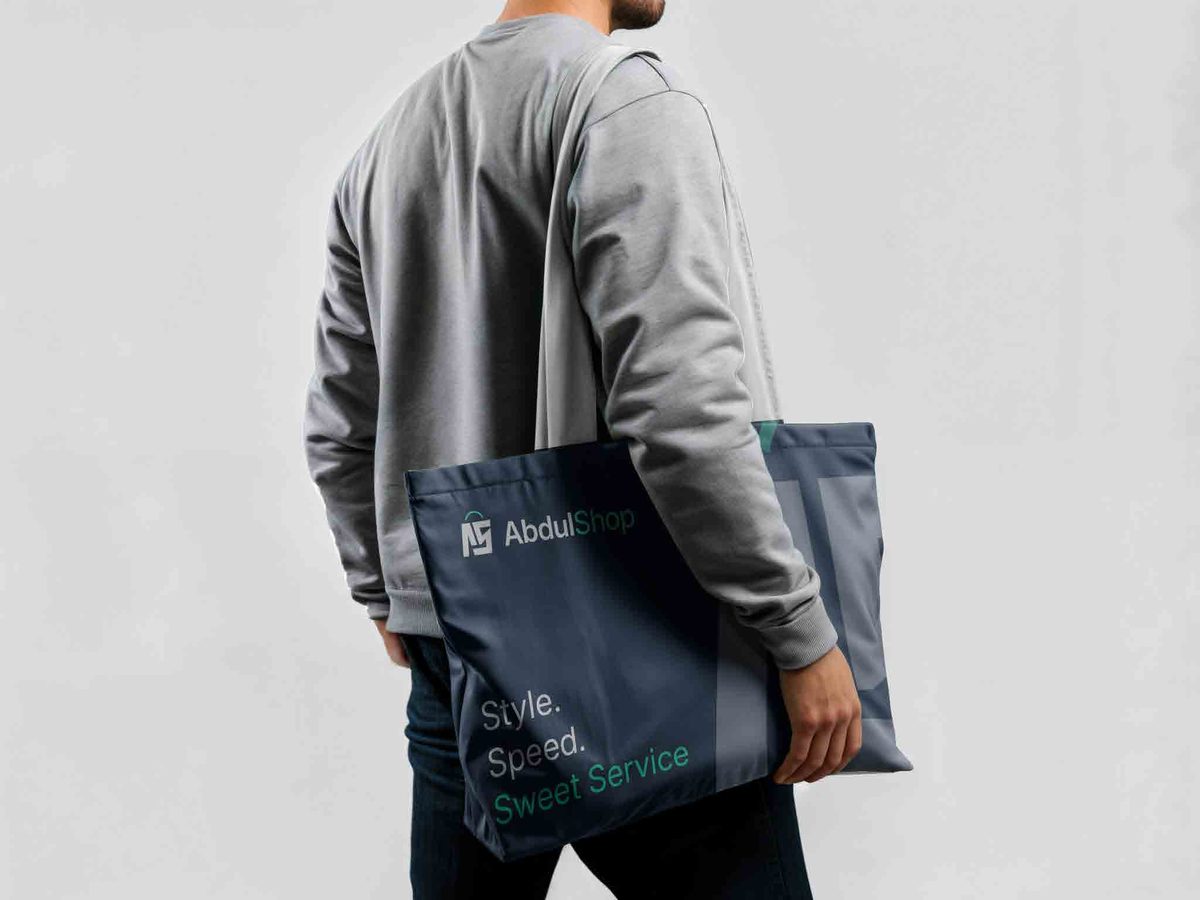 Customer carrying an AbdulShop branded bag